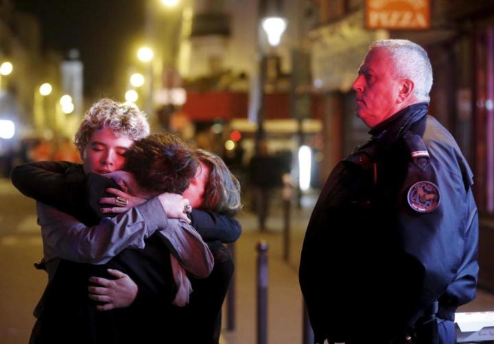 people-hug-on-the-street-near-the-bataclan-concert-hall-following-fatal-attacks-in-paris-france